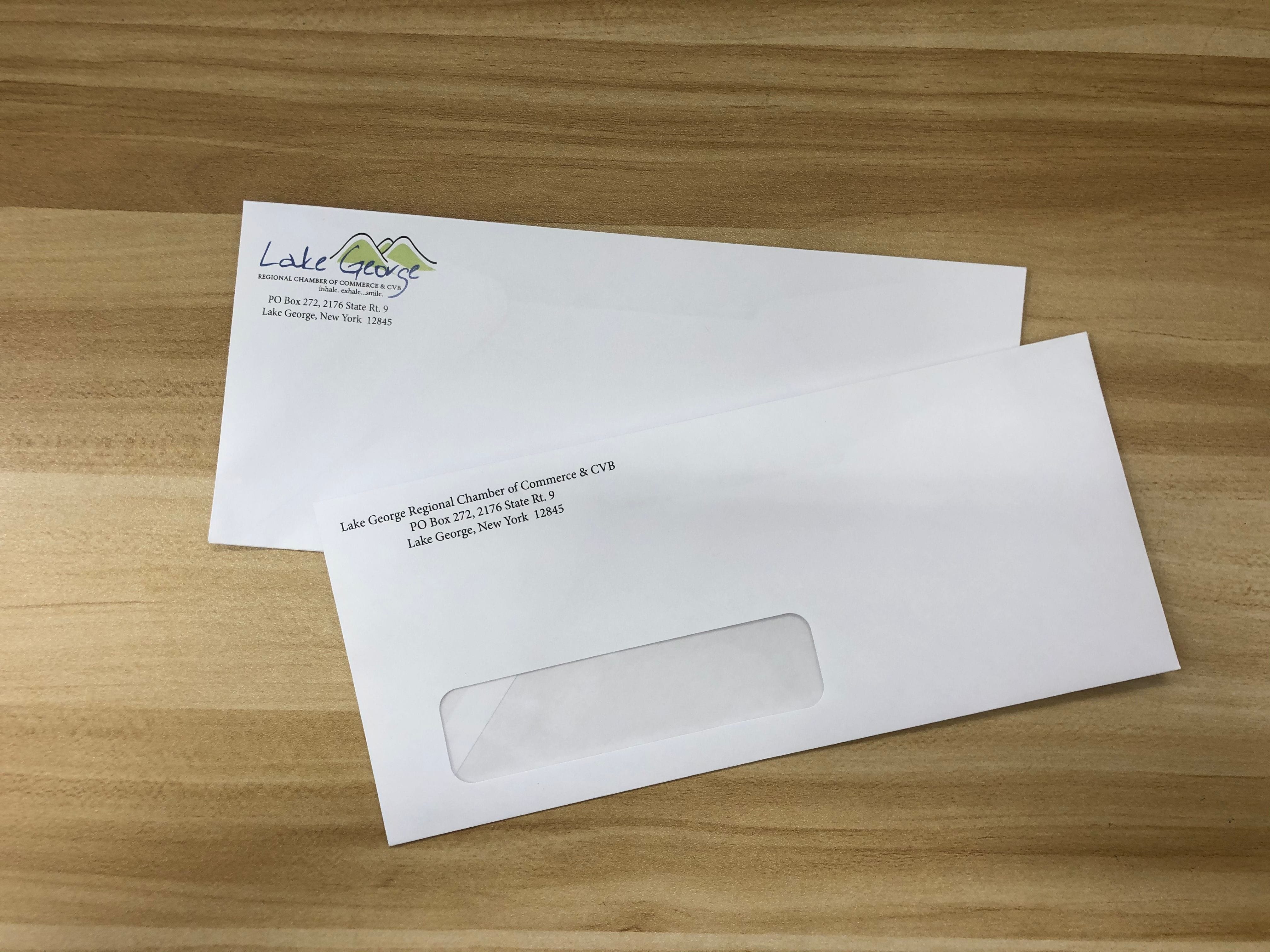 Full Color #10 Buiness envelope with logo in the corner with a #10 Window Envelope with a return address in black ink.